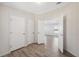 Bright hallway with hardwood floors and access to bedrooms at 1852 Cypress Point Ln, Sarasota, FL 34234