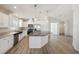 Modern kitchen featuring white cabinets, granite countertops, and a large island at 1852 Cypress Point Ln, Sarasota, FL 34234