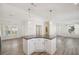 Kitchen island with dark countertop and white cabinets at 1852 Cypress Point Ln, Sarasota, FL 34234