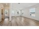Living room with light walls and vinyl wood flooring, view into hallway at 1852 Cypress Point Ln, Sarasota, FL 34234