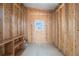 Unfinished storage room with wood shelving at 1852 Cypress Point Ln, Sarasota, FL 34234