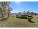 Spacious backyard with mature trees and a large deck at 2300 Restmere Ln, Spring Hill, FL 34609