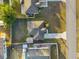 Aerial view of a house with a driveway and yard at 26416 Mcallister St, Brooksville, FL 34602