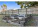 Relaxing backyard patio with fire pit and seating area at 26416 Mcallister St, Brooksville, FL 34602