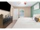 Bright bedroom with a king-size bed, dresser, and access to a backyard at 26416 Mcallister St, Brooksville, FL 34602