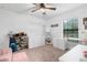Versatile bedroom with plenty of storage, a desk, and a comfortable armchair at 26416 Mcallister St, Brooksville, FL 34602