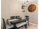 Dining area with black table, bench seating, and overhead lighting at 26416 Mcallister St, Brooksville, FL 34602