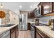 Modern kitchen with stainless steel appliances and granite countertops at 26416 Mcallister St, Brooksville, FL 34602