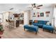 Open floor plan with kitchen island and L-shaped sofa at 26416 Mcallister St, Brooksville, FL 34602