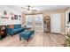 Cozy living room featuring L-shaped sofa and wood-look flooring at 26416 Mcallister St, Brooksville, FL 34602
