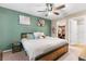 Spacious main bedroom with a king-size bed, and a large closet at 26416 Mcallister St, Brooksville, FL 34602