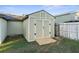 Large storage shed with double doors and a wooden ramp at 26416 Mcallister St, Brooksville, FL 34602
