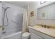 Updated bathroom with tub, shower, and modern fixtures at 3644 Trophy Blvd, New Port Richey, FL 34655