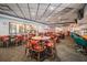 Clubhouse interior with dining tables and a bar area at 3644 Trophy Blvd, New Port Richey, FL 34655