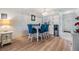 Bright dining area with a white table and blue chairs at 3644 Trophy Blvd, New Port Richey, FL 34655