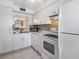 Efficient kitchen featuring white cabinetry and modern appliances at 3644 Trophy Blvd, New Port Richey, FL 34655