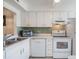 Efficient kitchen featuring white cabinetry and modern appliances at 3644 Trophy Blvd, New Port Richey, FL 34655