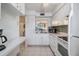 Efficient kitchen featuring white cabinetry and modern appliances at 3644 Trophy Blvd, New Port Richey, FL 34655