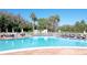 Inviting community pool with plenty of lounge chairs at 3644 Trophy Blvd, New Port Richey, FL 34655