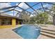 Screened-in pool and spa with a covered patio at 4264 River Birch Dr, Spring Hill, FL 34607