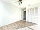 Bright bedroom with tile floors and a large closet at 4375 Tahitian Gardens Cir # B, Holiday, FL 34691