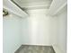 Spacious closet with overhead shelving and hanging rod at 4375 Tahitian Gardens Cir # B, Holiday, FL 34691