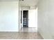 Clean hallway with tile floors and access to closet at 4375 Tahitian Gardens Cir # B, Holiday, FL 34691