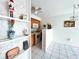 View of kitchen with wood cabinets and built-in shelving at 4375 Tahitian Gardens Cir # B, Holiday, FL 34691