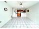 Open kitchen with wood cabinets and a breakfast bar at 4375 Tahitian Gardens Cir # B, Holiday, FL 34691