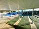 Covered shuffleboard courts near the pool at 4375 Tahitian Gardens Cir # B, Holiday, FL 34691