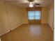 Bright bedroom with tile floors and double closets at 4746 Azalea Dr # 209, New Port Richey, FL 34652