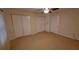 Bedroom with tile floors, double closets and ceiling fan at 4746 Azalea Dr # 209, New Port Richey, FL 34652