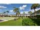 Community with pool, shuffleboard, and palm trees at 4746 Azalea Dr # 209, New Port Richey, FL 34652