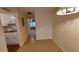 Dining area adjacent to kitchen with light-colored flooring at 4746 Azalea Dr # 209, New Port Richey, FL 34652
