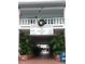 Condo building exterior, featuring a classic design and landscaping at 4746 Azalea Dr # 209, New Port Richey, FL 34652