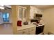 Updated kitchen with white cabinets and modern appliances at 4746 Azalea Dr # 209, New Port Richey, FL 34652