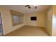 Living room with tile floors and a mounted TV at 4746 Azalea Dr # 209, New Port Richey, FL 34652