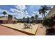 Community patio with tables and umbrellas at 4746 Azalea Dr # 209, New Port Richey, FL 34652