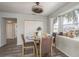 Casual dining area with glass table and four chairs near a hallway at 5406 Captains Ct, New Port Richey, FL 34652