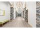 Welcoming hallway with wood-look flooring and stone accents at 6156 Spyglass Ct, Spring Hill, FL 34606