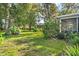 Expansive backyard featuring a lush lawn at 6432 Plantation Rd, Spring Hill, FL 34606