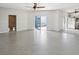 Large open basement with epoxy floor and access to patio at 7516 Gulf Way, Hudson, FL 34667