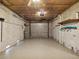 Garage with overhead door and storage shelves at 7516 Gulf Way, Hudson, FL 34667