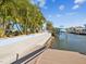 Concrete waterfront pathway, providing access to the dock and water at 7516 Gulf Way, Hudson, FL 34667