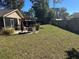 Expansive grassy backyard with patio and pergola at 8448 Foxboro Ln, Spring Hill, FL 34608