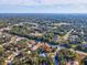 Aerial view of a single-Gathering home with a large backyard and surrounding neighborhood at 92 Randolph Ave, Spring Hill, FL 34606
