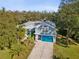 Aerial view of a two-story house with teal garage door at 92 Randolph Ave, Spring Hill, FL 34606