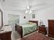 Bedroom with ceiling fan, wood furniture and area rug at 92 Randolph Ave, Spring Hill, FL 34606