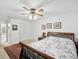 Bright bedroom with ceiling fan, wood furniture and area rug at 92 Randolph Ave, Spring Hill, FL 34606