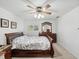 Bright bedroom with wooden furniture and plantation shutters at 92 Randolph Ave, Spring Hill, FL 34606
